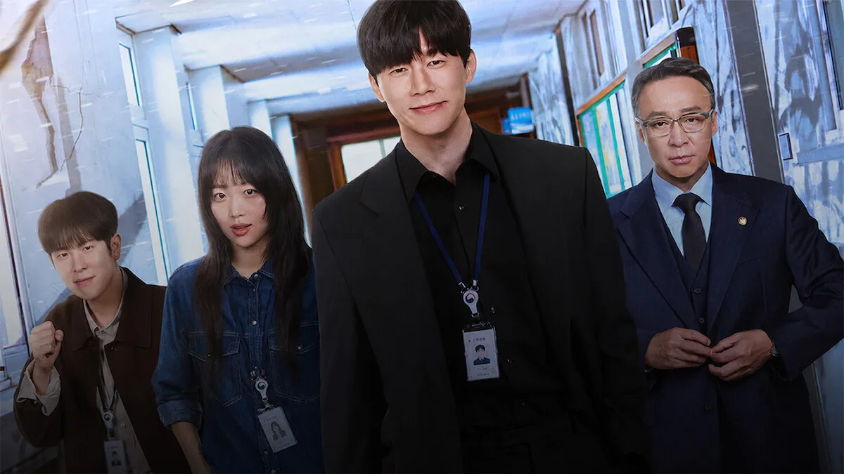 The Teach You a Lesson bureau team in a school hallway: Pyo Ji-hoon, Jin Ki-joo, Kim Mu-yeol and Lee Sung-min, left to right, with ID badges on lanyards